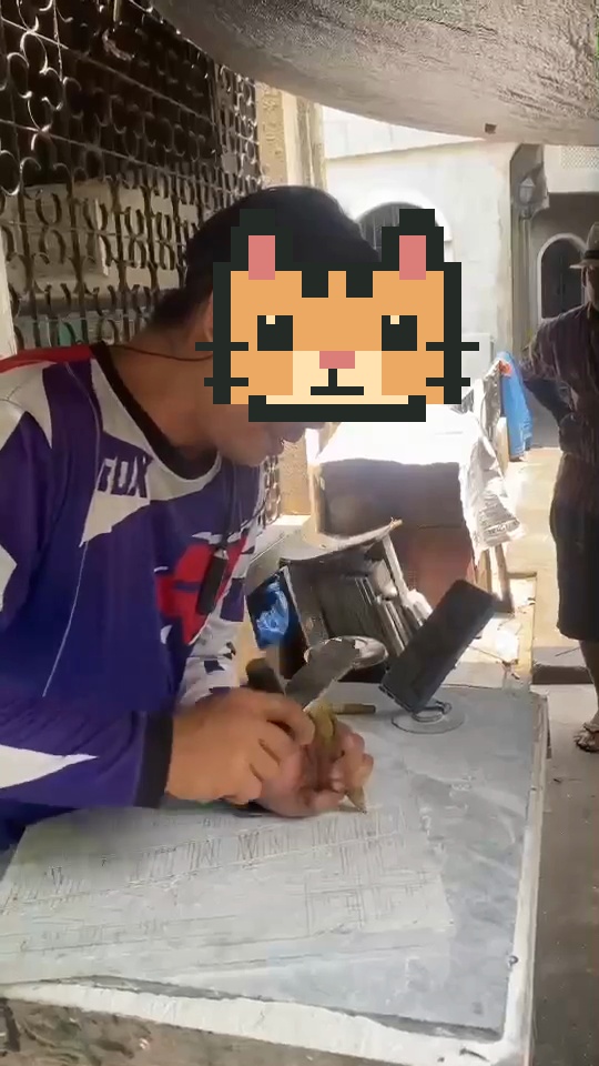 An operator engraving in a workshop